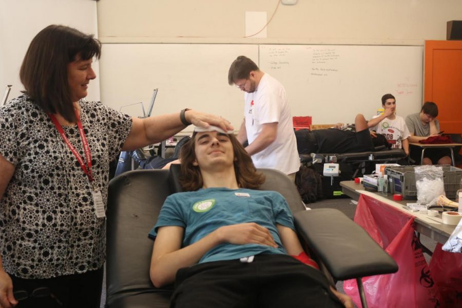 Senior, Caleb Stepper, doing power red for the blood drive