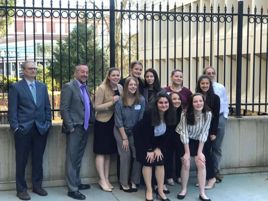 A photo of last years mock trials team. 
Back, Left to right: Rob Nichols, Matt Opitz, Emma Prine, Kate Gomes, Gabrielle Chambers, Grace Ingram, and Wesley Brewer. Front, Left to right: Julie Easton, Angelique Calhoon, Paula Jung, Madison Stryffeler, and Grace Armstrong.