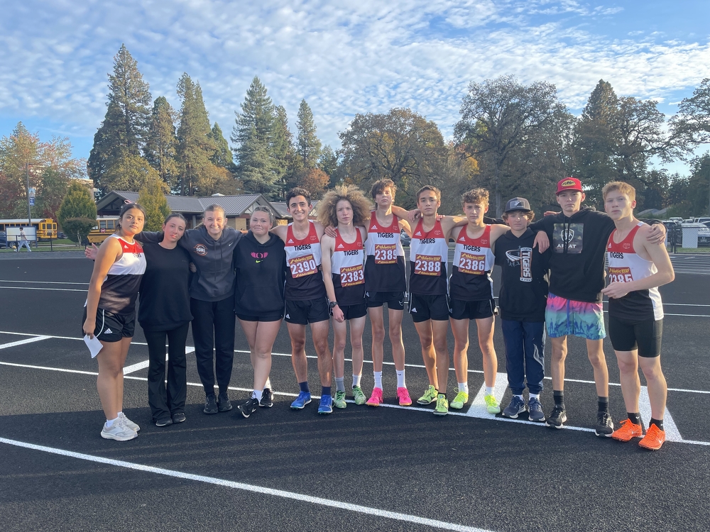 The cross country team posing for a picture after a race. 
Featured left to right: Dorismar Martinez, Mia Lehmann, Laurel Chadwick, Destiny Huldt, Lucas Partin, Zayden Aspey, Torsten Nordstrom, Chase McMullen, Logan Guinn, Joseph Petraitis, Talan Bryant, Louigi Etta, (not pictured) Lexton King.